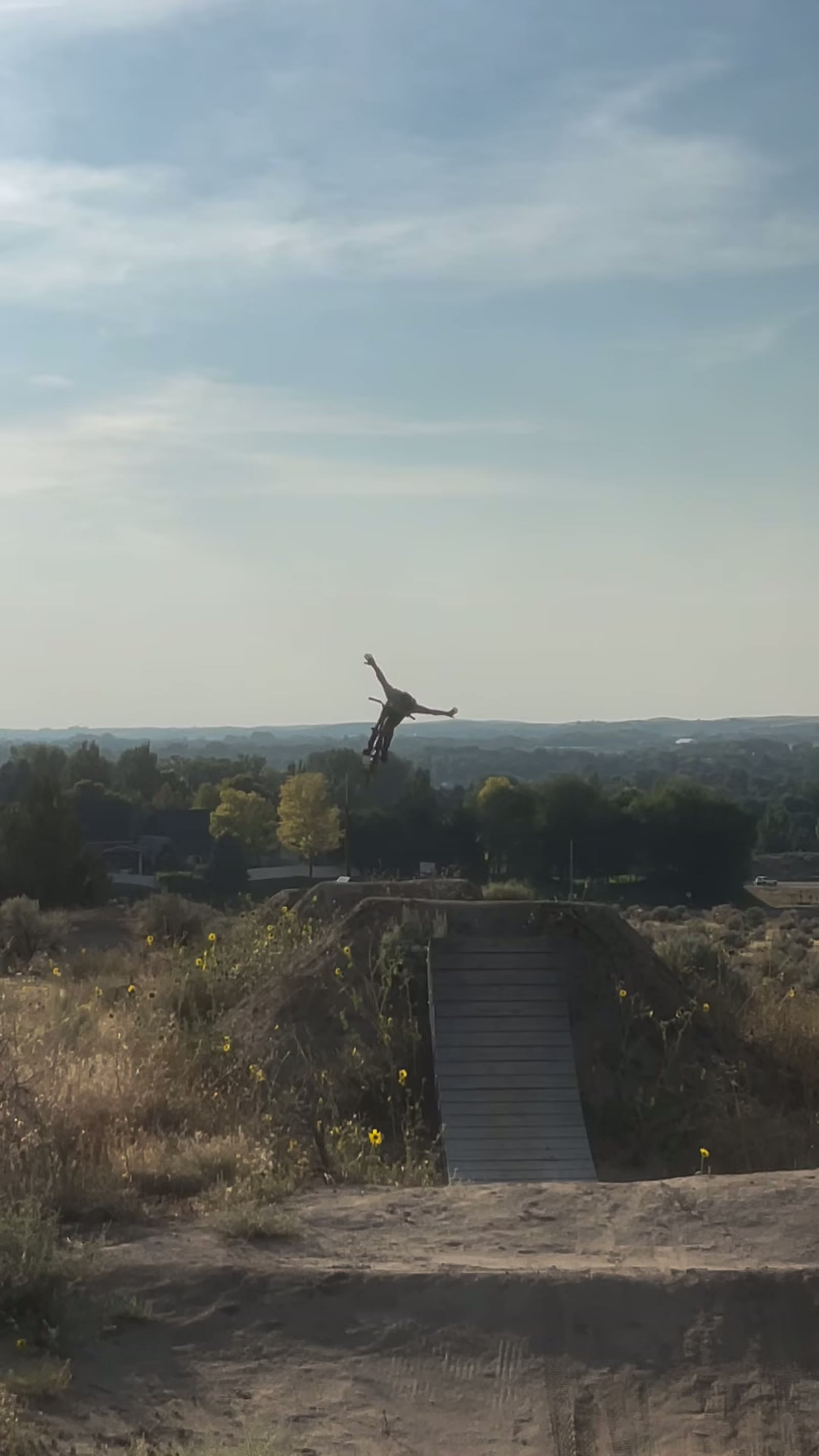 Melville Smith spread mid-air above the jump line