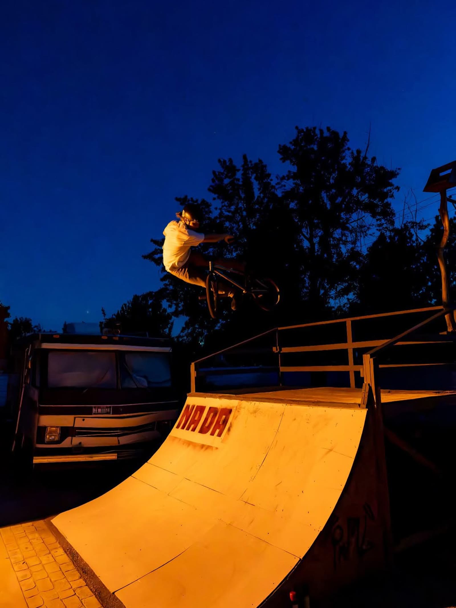 Melville Smith riding at night through a shower of sparks